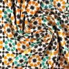 Detalle de fular verde y naranja inspirado en las geometrías islámicas