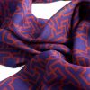 Detail of blue and red scarf with andalusí print